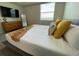 Main bedroom with a comfortable bed and dresser at 3161 Paradox Cir # 301, Kissimmee, FL 34746
