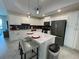 Modern kitchen with white cabinets and a large island at 3161 Paradox Cir # 301, Kissimmee, FL 34746