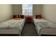 Two twin beds with Mickey Mouse themed bedding in a bright room at 3161 Paradox Cir # 301, Kissimmee, FL 34746