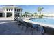 Resort-style pool with plenty of lounge chairs for relaxation at 3161 Paradox Cir # 301, Kissimmee, FL 34746