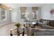 Cozy living room showcasing a gray sectional sofa and two end tables at 4204 Oakview Dr, Davenport, FL 33837