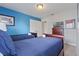 Bedroom with two twin beds and blue bedding at 4204 Oakview Dr, Davenport, FL 33837