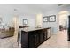 Open kitchen with a large island, granite countertops, and stainless steel appliances at 4204 Oakview Dr, Davenport, FL 33837