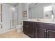 Bathroom with shower, toilet and dark brown vanity at 4204 Oakview Dr, Davenport, FL 33837