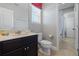 Bathroom with toilet, vanity, and shower/tub combo at 4204 Oakview Dr, Davenport, FL 33837