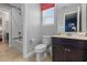 Bathroom with toilet, vanity, and shower/tub combo at 4204 Oakview Dr, Davenport, FL 33837