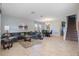 Spacious living room with L-shaped sofa and tile floors at 4204 Oakview Dr, Davenport, FL 33837