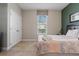 Bedroom with a queen bed, closet, and window at 4204 Oakview Dr, Davenport, FL 33837