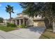 Two-story house with stone columns and landscaping at 4204 Oakview Dr, Davenport, FL 33837