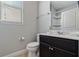 Clean bathroom with dark vanity, toilet and shower at 4204 Oakview Dr, Davenport, FL 33837