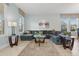 Spacious living room featuring a large sectional sofa and a stylish coffee table at 4204 Oakview Dr, Davenport, FL 33837