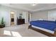 Bright main bedroom with a king-size bed and access to the bathroom at 4204 Oakview Dr, Davenport, FL 33837