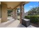 Covered porch with stone columns and storage container at 4204 Oakview Dr, Davenport, FL 33837