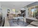Open concept living room with a view into the kitchen and access to a patio at 4204 Oakview Dr, Davenport, FL 33837