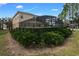 Landscaped backyard with privacy hedge and pool at 4204 Oakview Dr, Davenport, FL 33837
