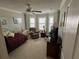 Comfortable bedroom with window seating, ceiling fan, and a TV at 566 Society Hill Cir, The Villages, FL 32162