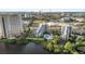 Aerial view of waterfront condos with a pool at 6165 Carrier Dr # 2, Orlando, FL 32819