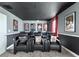 Home theater with reclining seats and movie posters at 8843 Interlocking Ct, Davenport, FL 33896