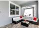 Covered patio with comfortable seating area and red accent pillows at 8843 Interlocking Ct, Davenport, FL 33896