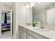 Double vanity bathroom with access to a bedroom at 8843 Interlocking Ct, Davenport, FL 33896
