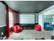 Home theater with a large projection screen and comfy seating at 8843 Interlocking Ct, Davenport, FL 33896