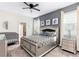 Main bedroom with a large bed, nightstands and a crib at 8843 Interlocking Ct, Davenport, FL 33896
