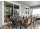 Covered patio with outdoor dining set and sliding glass doors at 8843 Interlocking Ct, Davenport, FL 33896
