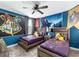 Harry Potter themed bedroom with twin beds, nightstands, and wall murals at 8843 Interlocking Ct, Davenport, FL 33896