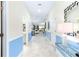 Bright entryway with light tile floors and blue and white color scheme at 8843 Interlocking Ct, Davenport, FL 33896