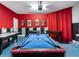 Game room with a pool table, air hockey, and foosball table at 8843 Interlocking Ct, Davenport, FL 33896