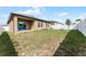 Large backyard with patio and grassy area at 928 Orchid Grove Blvd, Davenport, FL 33837