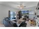 Gathering room with sectional sofa, large TV, and built-in shelving at 928 Orchid Grove Blvd, Davenport, FL 33837
