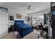 Bedroom with king-size bed, workspace, and window at 928 Orchid Grove Blvd, Davenport, FL 33837