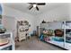bedroom with bunk bed, desk, and storage at 928 Orchid Grove Blvd, Davenport, FL 33837
