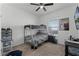 Bedroom with a full-size bed, bunk bed, and window at 928 Orchid Grove Blvd, Davenport, FL 33837