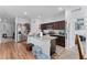 Modern kitchen with granite countertops and dark brown cabinets at 928 Orchid Grove Blvd, Davenport, FL 33837