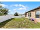 Grass backyard with privacy fence and playset at 928 Orchid Grove Blvd, Davenport, FL 33837