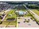 Aerial view of community pool, playground, and parking at 928 Orchid Grove Blvd, Davenport, FL 33837