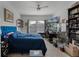 Spacious bedroom with a king-size bed, workspace, and built-in shelves at 928 Orchid Grove Blvd, Davenport, FL 33837