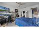Spacious bedroom with a king bed, workspace and large TV at 928 Orchid Grove Blvd, Davenport, FL 33837