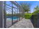 Relaxing pool and spa with screened enclosure and patio at 10564 Royal Cypress Way, Orlando, FL 32836