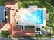 Directly above view of community pool and clubhouse at 10564 Royal Cypress Way, Orlando, FL 32836