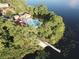 Aerial view of community pool and lake access at 10564 Royal Cypress Way, Orlando, FL 32836