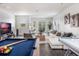 Game room featuring a pool table, comfortable seating, and large TV at 10564 Royal Cypress Way, Orlando, FL 32836