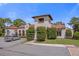 Community clubhouse with Spanish-style architecture at 10564 Royal Cypress Way, Orlando, FL 32836