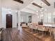 Open concept dining room with wood table and modern chandelier at 10564 Royal Cypress Way, Orlando, FL 32836