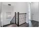 Modern staircase with dark wood railings and flooring at 10564 Royal Cypress Way, Orlando, FL 32836