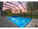Inviting pool and spa area with a screened enclosure, perfect for relaxation at 10564 Royal Cypress Way, Orlando, FL 32836