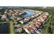 Aerial view of community and lake at 10564 Royal Cypress Way, Orlando, FL 32836