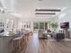 Open concept kitchen with island and breakfast bar at 10564 Royal Cypress Way, Orlando, FL 32836